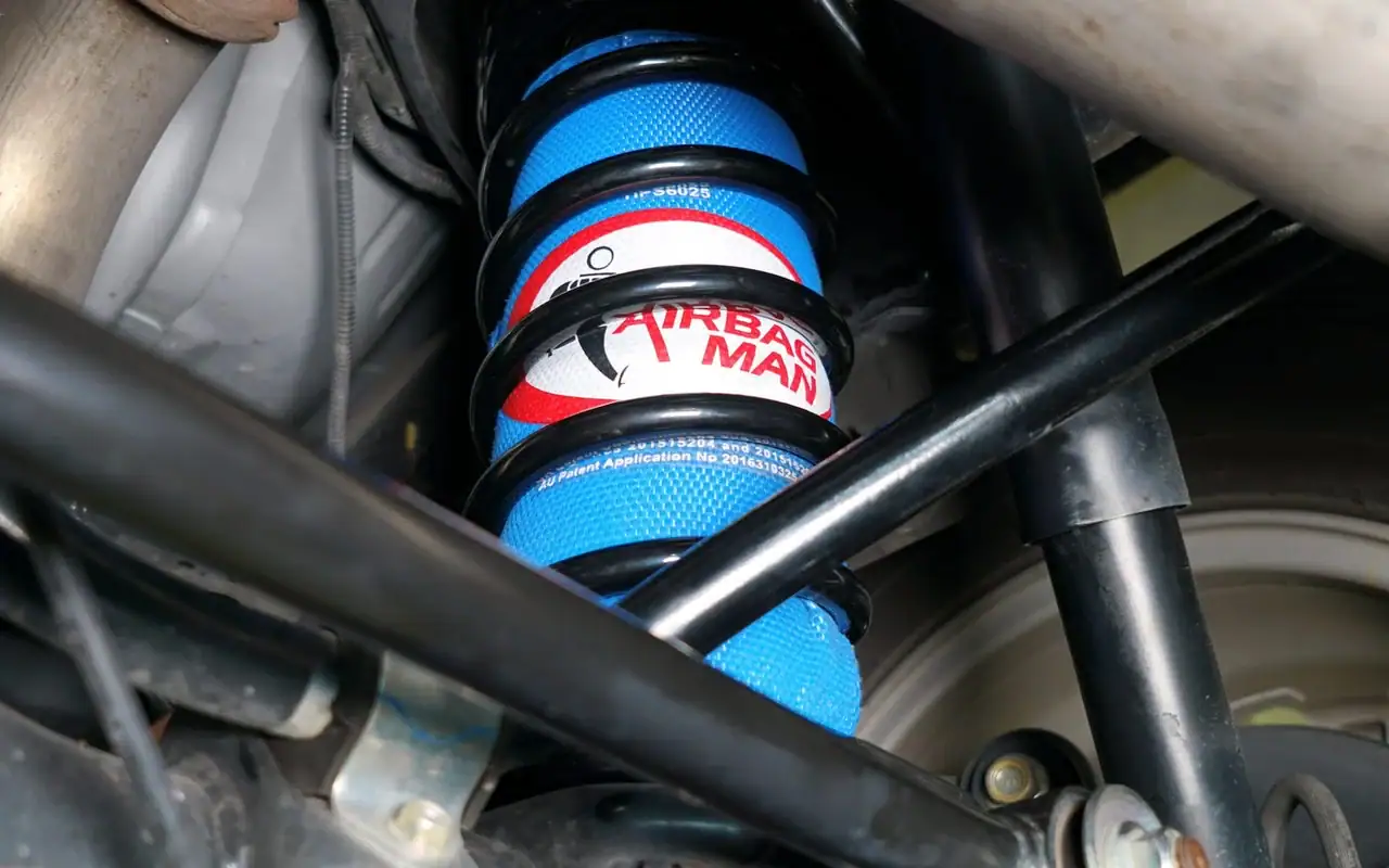 Airbag Man coil-assist airbag fitted inside a rear coil spring