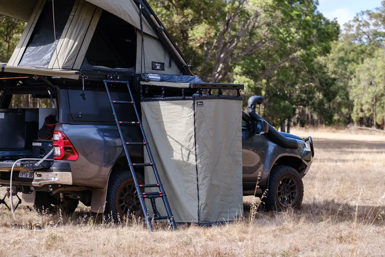 GVM Upgrades | M4C M4C's N80 Hilux SR5 touring build at camp with the rooftop tent open